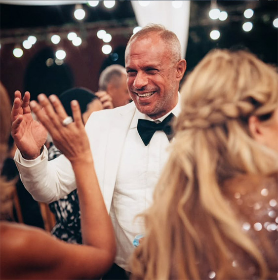 Mohamed Aboeloyoun, the tour guide, dancing in a white suit.